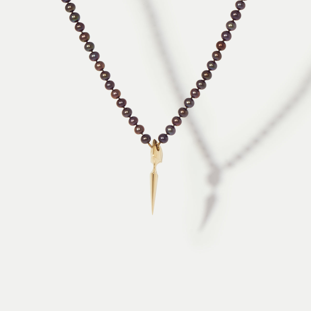 Spur Yellow Gold Pendant on Pearls